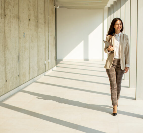 Young businesswoman walking on modern office hallw 2022 10 24 23 21 33 utc