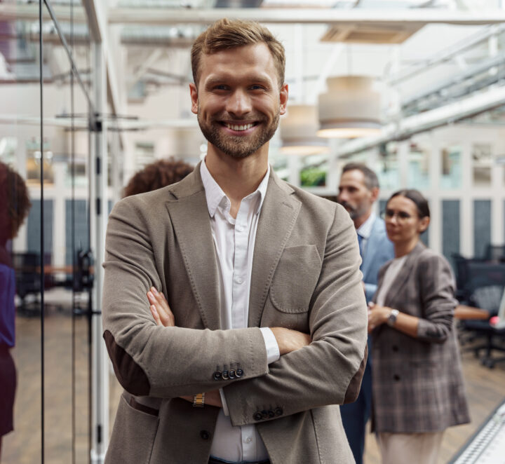 Portrait of smiling businessman standing in modern 2022 09 30 21 12 32 utc